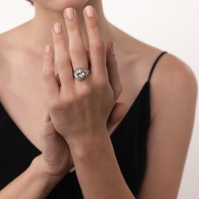 This exceptional Art Deco diamond and sapphire engagement ring is a romantic 1920’s design, centered by a GIA-certified...