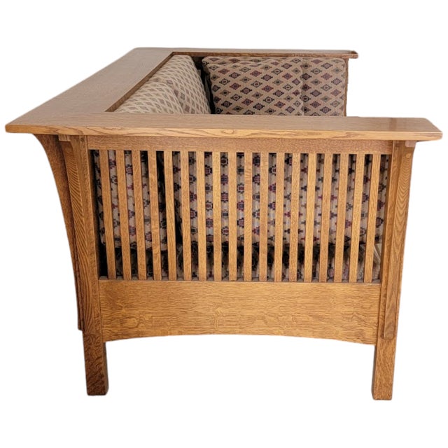 This solid quarter-sawn oak settee is based on the iconic L & JG Stickley design, and part of the 1989 Mission Collection...
