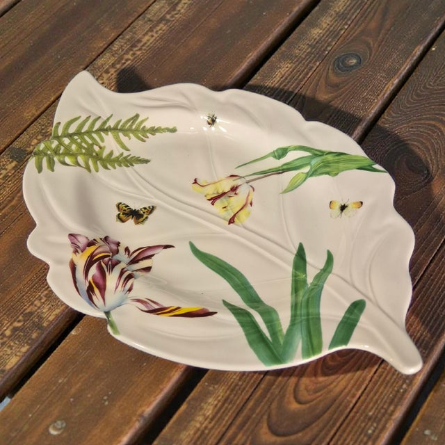 The Vintage Floral Haven Spode Leaf Shaped Floral Platter is a beautiful addition to any table setting. Made of fine...