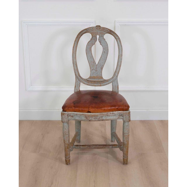 Rare and attractive 18th century Swedish Gustavian chair retaining its original painted surface and period leather seat....