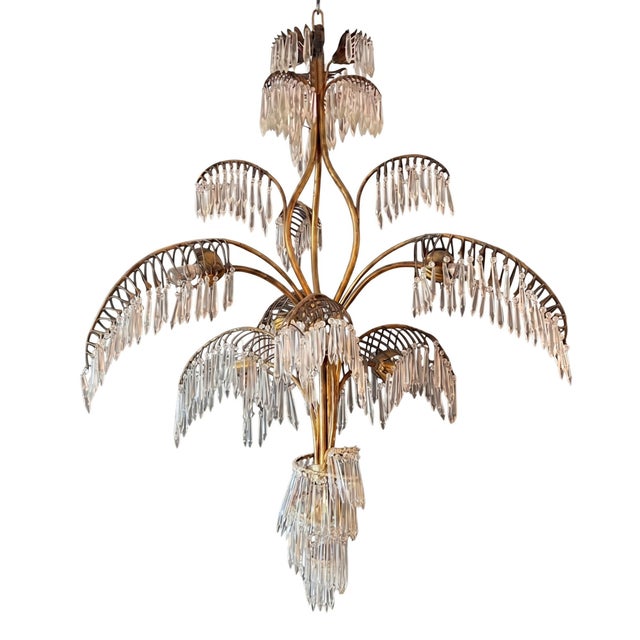 This elaborate chandelier was made in France in the 1950s in a distinctly Hollywood Regency style. A stylised palm tree...