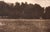 An original photogravure from Edward S. Curtis's The North American Indian. Fort Lapwai looks across an open, grassy field...