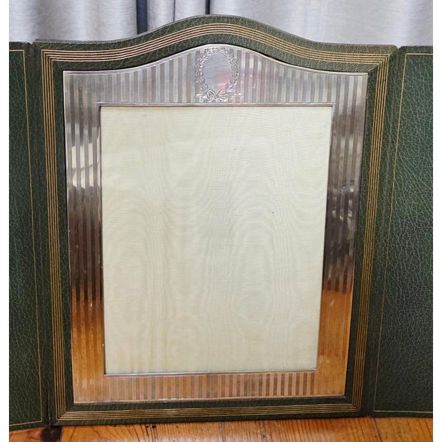 This striking antique Edwardian era triptych folding photo frame is a superb example of early 20th-century luxury desk...