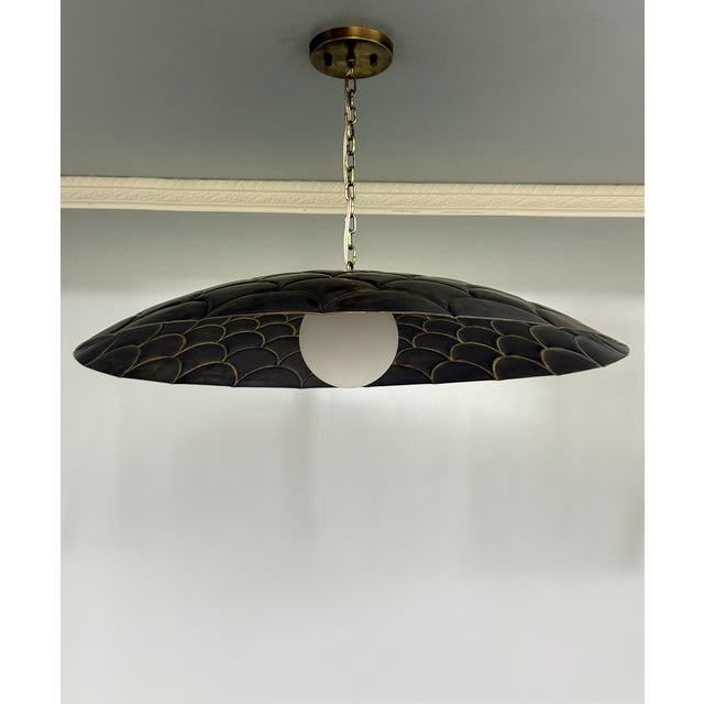 Bring artistic texture and warm metallic elegance to your space with this fish-scale style brass ceiling light. Designed...