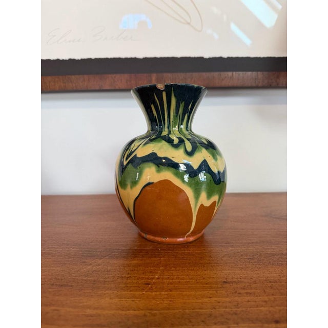 French mid-century vase with drip glaze, in tones of blue and yellow on a terracotta colour background. Bought in Paris...
