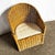 Earthy elegance meets laid-back luxury in this vintage Boho Chic wicker lounge chair. Handwoven in warm honey-toned rattan...