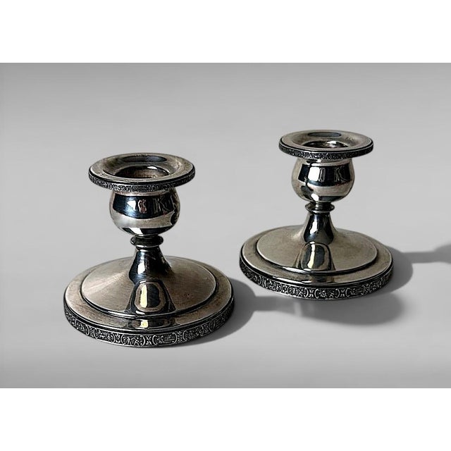 Elegant pair of small American silver plate candlesticks from the refined “Dutchardt” line produced by Bernard Rice’s Sons...
