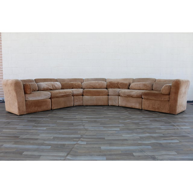 A fabulous vintage 1970s seven-piece modular sectional sofa upholstered in wonderfully soft tan suede leather. With its...