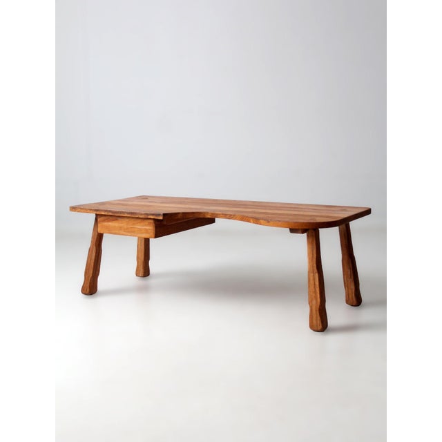 Classic Ranch Oak coffee table by the Brandt Company of Fort Worth, Texas, featuring a sculpted organic-shaped top and...