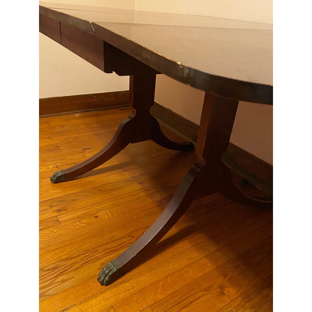 This Vintage Brown Wood Versatile Drop Leaf Double Pedestal Dining Table would work in a dining room, living room, bedroom...