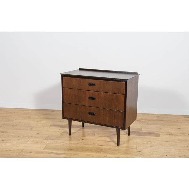 Mid Century teak dresser made and manufactured during the 1960s in the Denmark. The dresser has profiled handles. The...