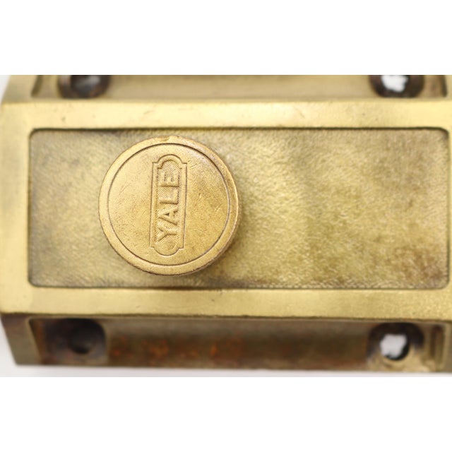 Reclaimed spring loaded surface mount night latch made of brass. Made by Yale. The original cylinder lock and key are not...