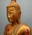 Elegant antique standing Thai Buddha figure, finely carved and richly gilded Depicted in a serene posture with hands...