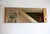 Large smoked mirror with an asymmetrical frame, 1970s. Black marks on the wood frame, minor age-related misalignment...