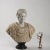 Bust of Roman emperor in white marble and flowery alabaster, Italy mid -20th century. Alabaster toga. Black marble base....