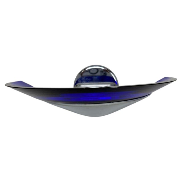 A dramatic vintage Italian Postmodern wall sconce, circa 1980s, featuring a sculptural crescent of brilliant cobalt-blue...