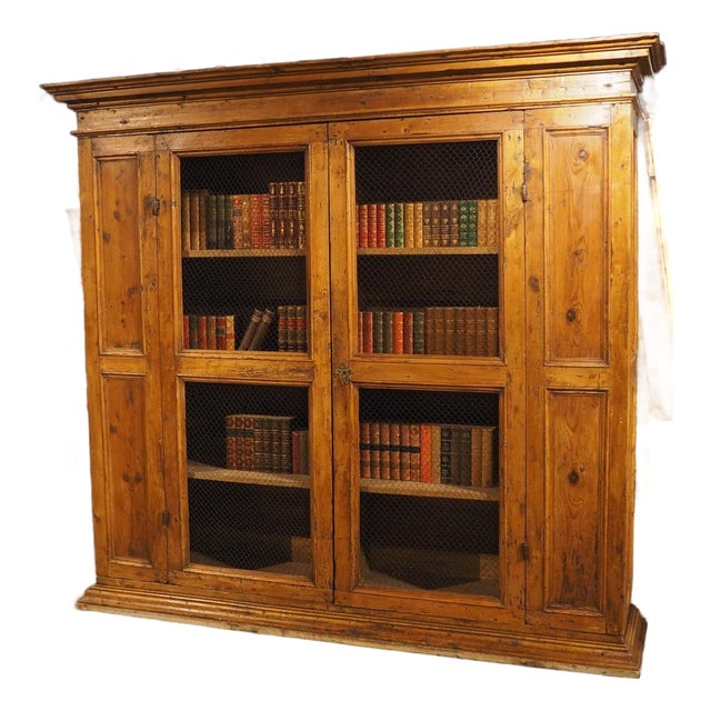 A Circa 1800 Tuscan Pine Bookcase With Wire Panels For Sale
