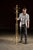 Early 20th century brass coat tree. This freestanding coat stand features a polished brass finish with elegant turned...