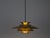 The lamp's form was designed based on the principle of a reflective system that directs light not only downward but also...