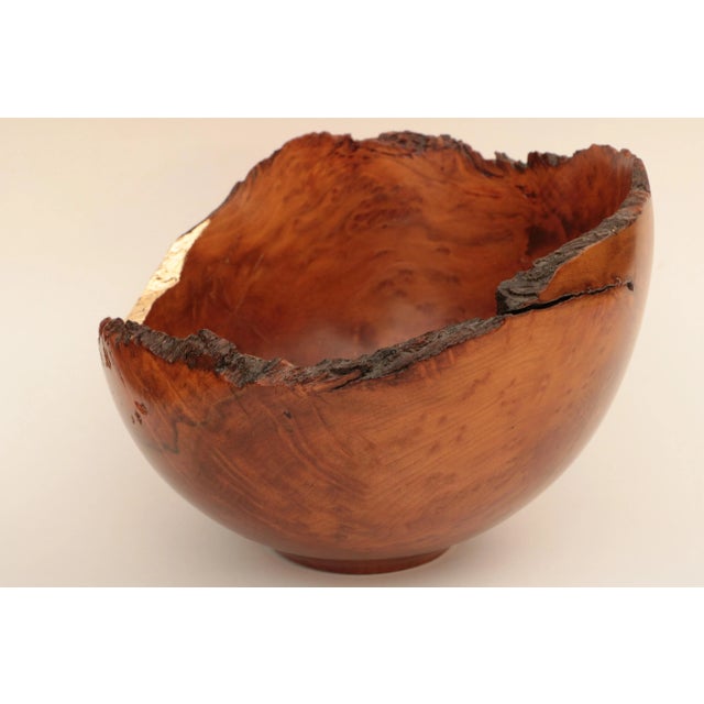 Handmade turned wooden bowl made from California Redwood Burl. A portion of the edge has been enhanced with 24 karat gold...