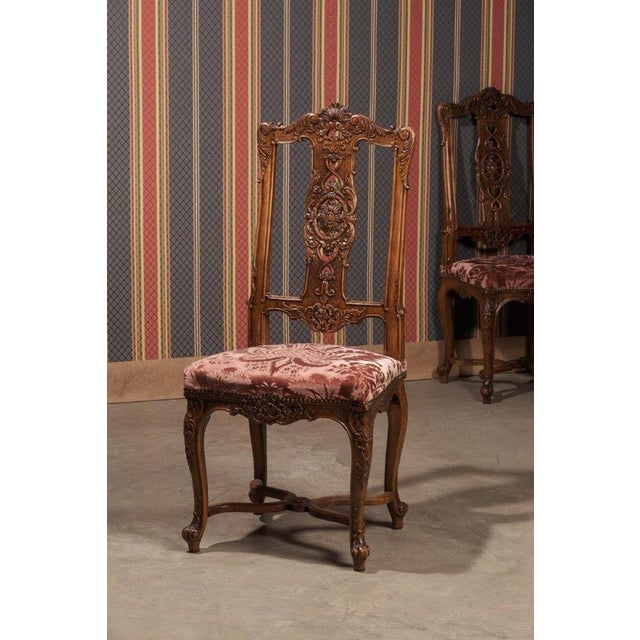 An extraordinary set of 12 French dining chairs, manufactured in the late 19th century, crafted from high-quality...