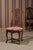 An extraordinary set of 12 French dining chairs, manufactured in the late 19th century, crafted from high-quality...