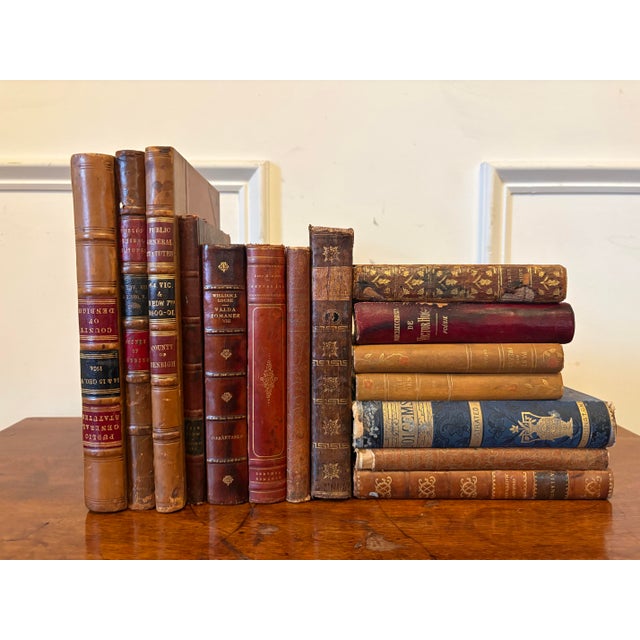 Group of 15 Assorted Leather or Marbled Bound Books, 19th Century. Books are for decorative purposes and they are from...
