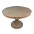 Round solid teak dining table with traditional carved pedestal base. Hand distressed with a warm light grey wash finish....