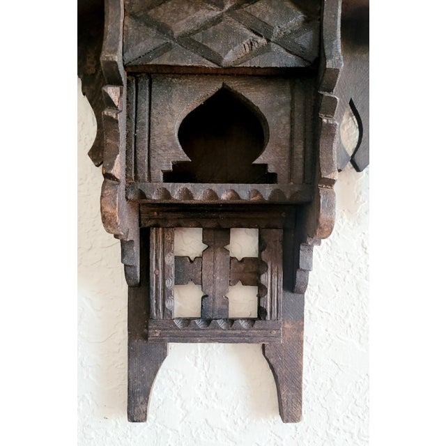 Vintage handcrafted and hand carved reclaimed wood wall shelf from Morocco. Aged brown is the color. Berber style. Would...