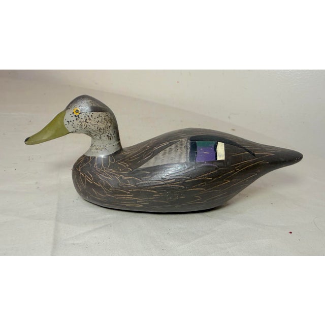 This vintage 1983 hand carved wood Clarence Bauer miniature duck decoy sculpture is a unique and collectible piece of art....