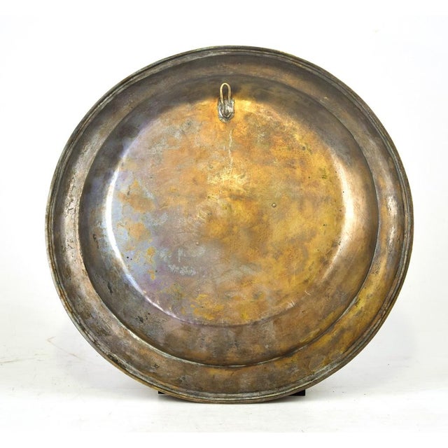 This Almoner plate is an original decorative pewter object realized in Tuscany, Italy by Italian manufacture in the second...