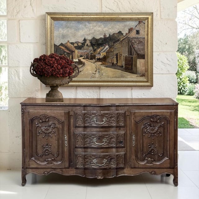 Richly observed and historically important, this Belgian oil painting captures the quaint village of Esneux as viewed from...