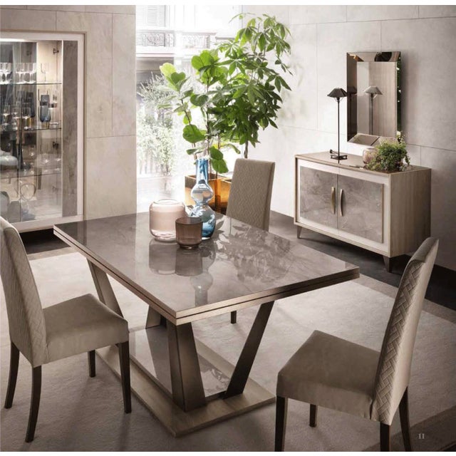 Elevate your dining space with this breathtaking 10-piece luxury dining collection, designed for sophisticated interiors...