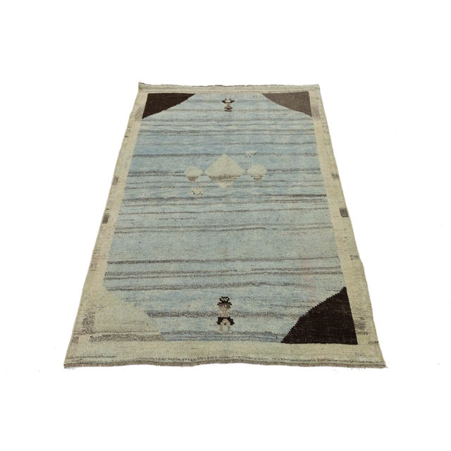 Transform your space with this modern Gabbeh wool rug, blending tribal weaving traditions and contemporary design. Its...