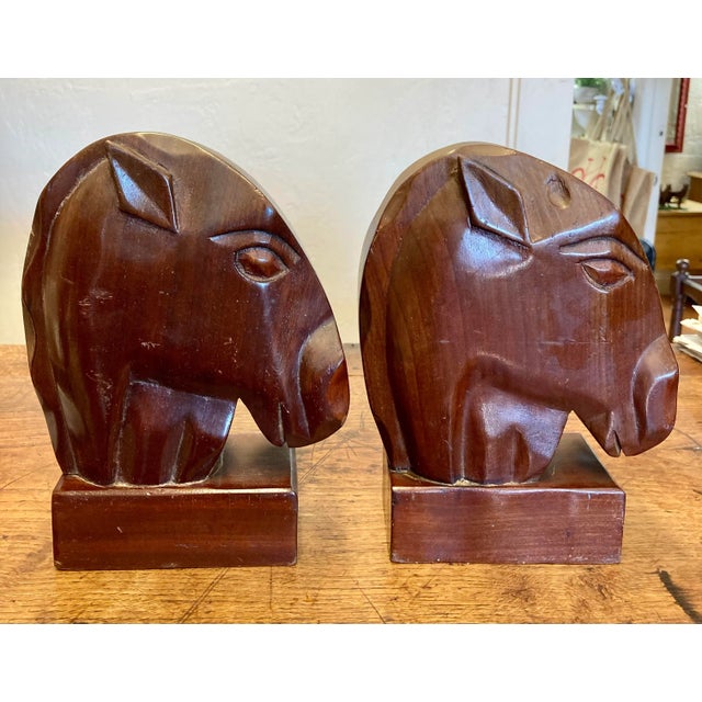 This striking pair of vintage wooden horse head bookends offers a bold and sculptural presence, with a form that borders...