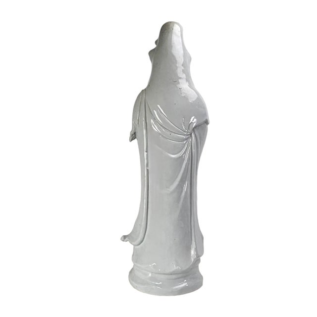 A serene porcelain figure rises in quiet majesty, her flowing robes pooling like water around her feet. This 30-inch...