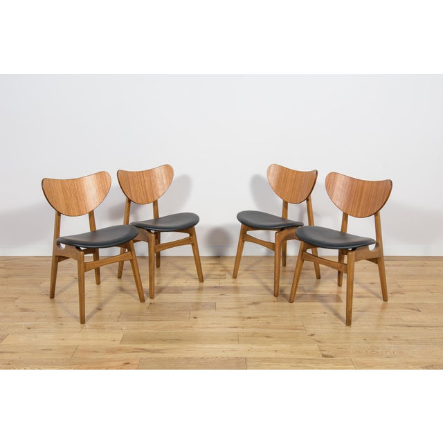 The mid-century four dining chairs were manufactured by G-Plan in the UK during the 1950s. The frame is made of beech...