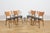 The mid-century four dining chairs were manufactured by G-Plan in the UK during the 1950s. The frame is made of beech...