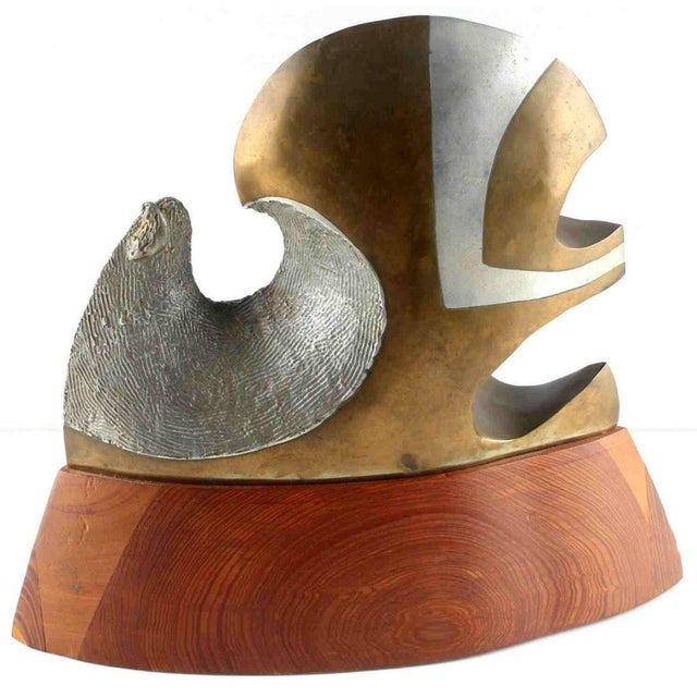 Chester L. Williams Label on bottom, signed. Title: Promethium Medium: Bronze, Aluminum and wood. Approx. dimensions: 12 X...
