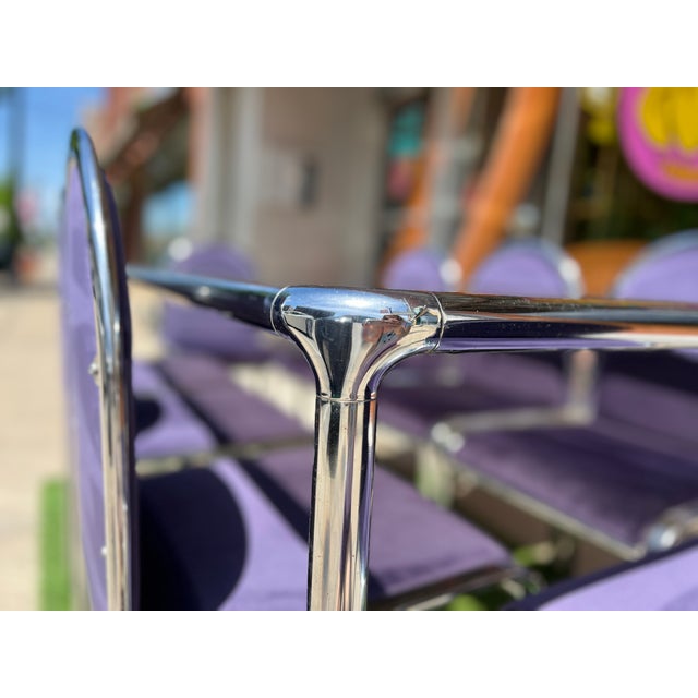 1970's Italian dining set, featuring sleek chrome metal frame, with thick, smoked glass top. Includes 8 matching chairs...