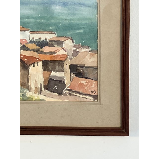 Beautiful mid-20th-century watercolor depicting a sunlit Mediterranean hillside village with terracotta rooftops clustered...