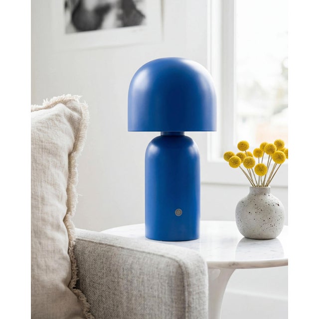 Illuminate your space with the Umbra accent table lamp, a beacon of minimalist modern style. Standing at a sleek 10 inches...