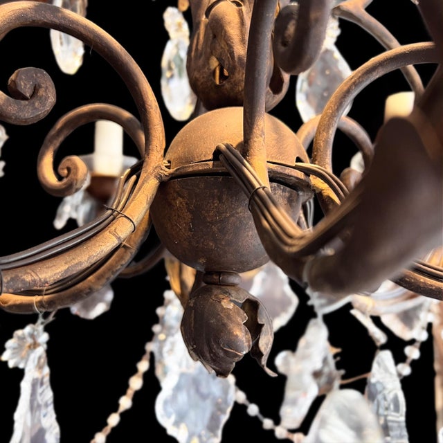 This chandelier was made in France in the 1920s. The chandelier has a gilt metal frame with a nice warm patina. The design...