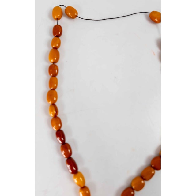 We are selling this nice butterscotch egg yolk amber necklace. This necklace features naturally rounded and tumbled oblong...