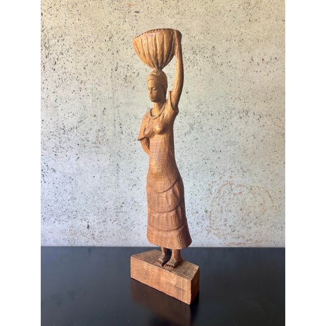 A beautifully expressive carved wood sculpture by renowned Haitian artist Roger François (1928–2013), circa 1970. The...