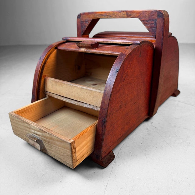 This wooden sewing box from the 1940s, originating from Germany, is the kind of charming household piece that remains...