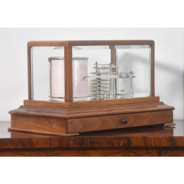 John Trotter walnut-cased Barograph, having five beveled glazed removable lid, and a drawer below to house the charts. The...