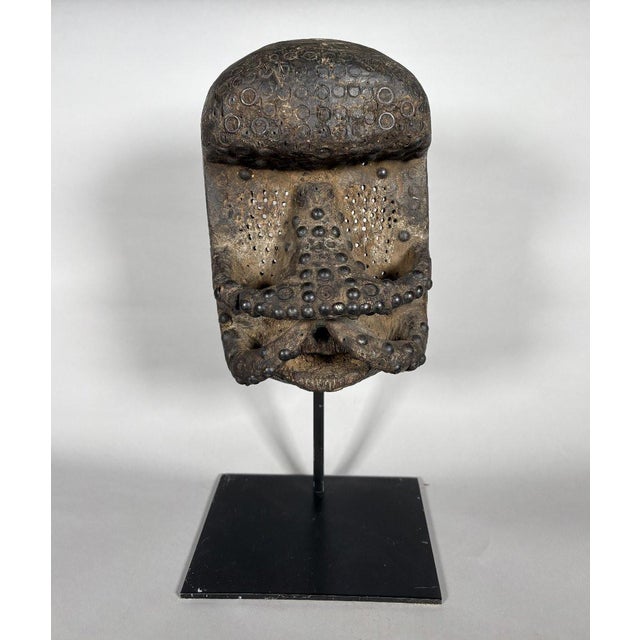 Dan-Guéré (Ivory Coast). Antique dancer's mask. Oval face with a domed forehead, sculpted with geometric lines connecting...
