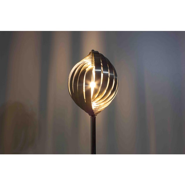 Striking sculptural floor lamp by French designer Henri Mathieu, made in the 1970s. The shade is constructed from a series...