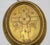 Pair of gilt porcelain plaques is a decorative object realized in the early 20th Century. Liturgical discs depicting...
